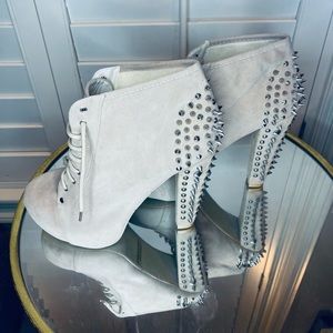 Brand New Suede shoes with spikes. They have never been worn.